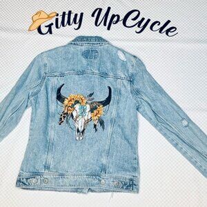 Distressed Light Blue jean jacket, ironon cow skull/flowers with rhinestone S
